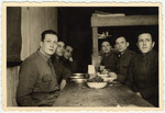 Polish prisoners-of-war celebrate Channukah in their barracks with potato pancakes.
