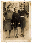 Three young women pose on a street in Pulawy.

Elcia Rechenman is pictured in the center.