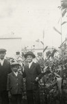David, Bezalel and Zvi Schaechter stand in the garden of their home in Tacovo.