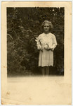 Halina Litman, nine years old, takes her first communion while in hiding in Jaroslaw.
