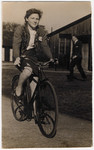Halina Litman rides a bicycle after she moved to Maghol, England, following her survival in hiding.