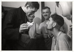 A Polish priest visits German POWs and offers them cigarettes.