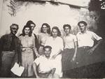 Felix Goldschmidt (left) director of the Versailles children's home, a religious OSE home, poses with a group of teenagers.