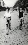 Marcel Confino and Joseph Dekalo ride their bicycles down a street in Stara Zagora.