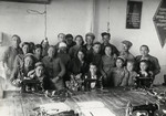 Workers at the Sparta shoe factory pose with their sewing machines.