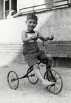 Five-year-old Benjamin Markowicz rides his bicycle in the Mariendorf displaced persons camp.
