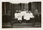 Group portrait of Dutch Red Cross nurses.

Among those pictured is Minnie van Dam.