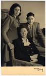 The Vromen family poses for a postwar studio portrait.
