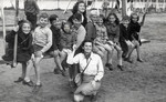 Jewish children play outside in a postwar children's home in Berg Stichting

Herman Rosenbaum is pictured seated 5th from the left.