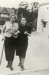 Ruchla Sternfeld walks down the street with her mother, Rivka (nee Wakstein).