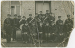 Group portrait of the members of a firemen's orchestra in Jurbarkas, Lithuania.