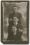 Studio portrait of three Polish Jewish youth in Nowogrodek.