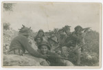 Lt. Yehuda Bielski (right, sitting on a rock) leads a unit of Israeli soldiers during the War of Independence.