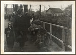 Ethnic German women cross the Elbe River into Germany after their expulsion from Eastern Europe.