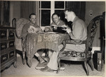 Joseph Eaton, an American soldier assigned to the 4th Communications Unit, types a report in the home that had formerly belonged to an SS doctor.