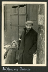 Close-up portrait of a bearded man and young child in the Deblin-Irena ghetto.