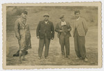 Group portrait of four men in a Bulgarian labor camp.