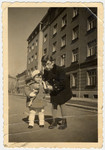 Rina and her cousin Reuven Stein pose on a street in Zagreb.
