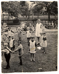 Children in a kindergarden in Gladbelk, Germany hold hands in the school playground.