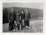 The Malach family poses with their friends and cousins, the Reichmans in Amberg.