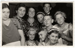 Group portrait of Latvian Jews at a wedding celebration.