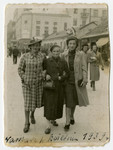 Chana Szwarcberg Kupersztajn (middle) walks down the street with her two daughters: Hinda Biberman on the left and Klara on the right.