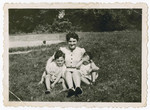 Frymetta Hochglaube poses outside with her two children at the Red Castle in Linden, outside of Brussels, during a rare visit.