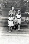 Regina and Ruth Anders stand next to a statue with their Christian aunt and future rescuer, Mathilde Anders.