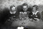 Raifeld/Welner siblings celebrate Hanukkah. 

Pictured from left to right are Ruth Anders, Theo Raifeld and Regina Anders