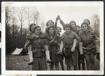 Teenage girls pose together while on camping trip with the Eclaireurs Israelites.