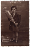 Ingeborg Majewski poses with a cone of treats on her first day of school.