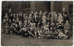 Group portrait of the children of the Jewish school in Koenigsberg posing outside during its inauguration festivities.