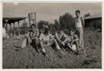 Members of a Palmach unit, most of whom had spent the war together in a children's home in Switzerland, rest on the grounds of an outpost.