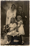 Wedding portrait of an SS officer with his wife and two children.