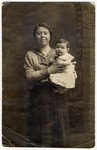 Studio portrait of an unidentified woman holding a young infant, relatives of Regina Goldberg.