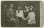Studio portrait of the Eisenstein family.

From left to right are Otto, George, Matilda and Vilma Eisenstein.