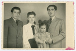 Studio portrait of the Wilonsky family taken to send to their relatives in the United States who were sponsoring their immigration so they would recognize them.