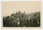 A photograph of a group's arrival at Eisenach displaced persons camp in Germany.