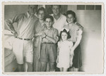 Postwar group portrait of the Zimmerman family.

From left to right are Chaskiel Zimmerman, Karola Ogurek Zimmerman, Jerzy Ogurek Zimmerman, and Chaskiel's brother, wife and daughter.