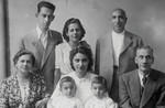 Group portrait of an extended Jewish family who fled to Italy.