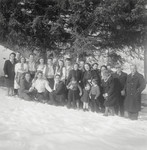 A picture of a large group of people on a snowy hill.