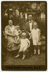 A Czech-Jewish family poses for a portrait in their garden.