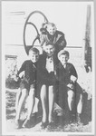 Leopolda Kuropieska poses with three boys during the war.