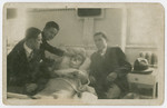 Adolf Lebovics (first man on the left ) and a group of friends visit and shave the face of a hospitalized friend.