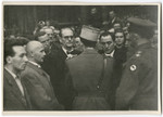 The mayor of Lueneburg is forced to attend the funeral for 243 slave laborers who  were shot by their guards on the railway lines at Lueneburg on the way to the Belsen Camp.