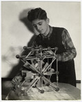 A student builds a simple machine at the Mediterranean School in Recco, Italy.
