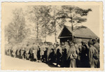 The caption in German says, "Transport of 2,100 prisoners."  They are most likely Soviet POWs.