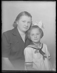Studio portrait of Lajosne [wife of Lajos] Berger and her daughter.
