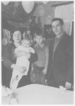 The Nussbaum family poses in their home in Sandomierz.