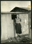 Kurt Feigenbaum stands next to a barrack in the Saint Cyprien camp after his deportation from Belgium.